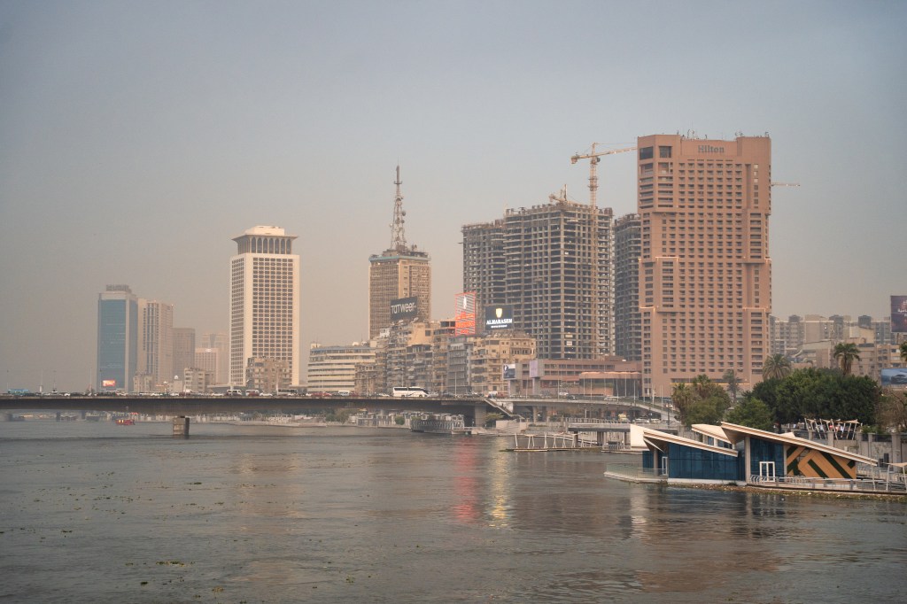 The Nile, a bridge and Cairo’s skyline at dusk.