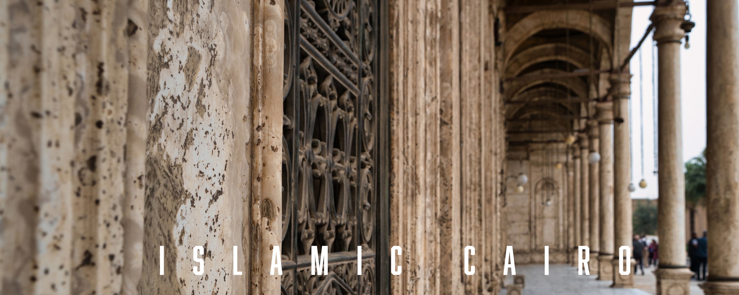 A stone colonnade with the title Islamic Cairo.