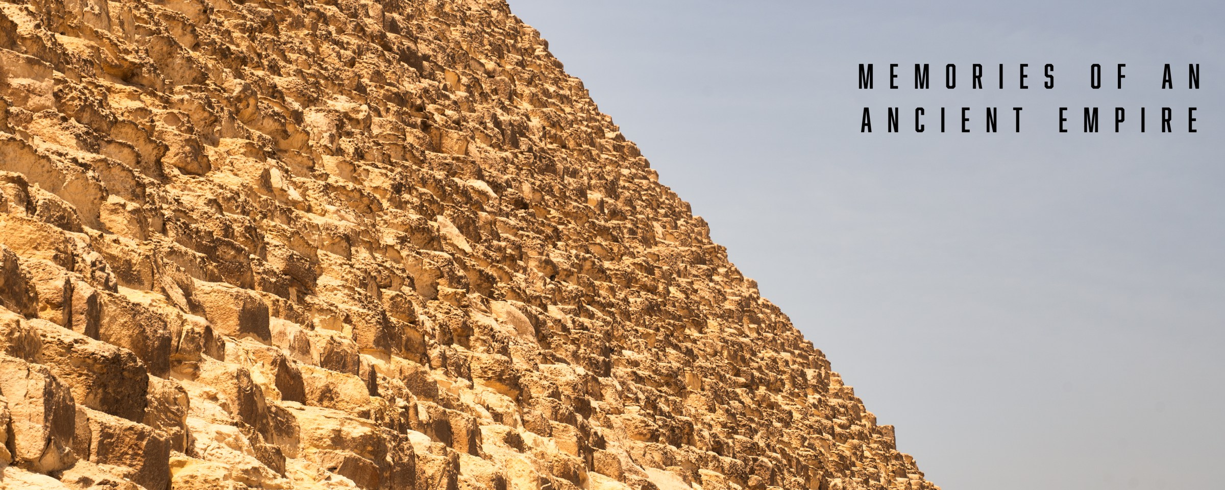 Memories of an Ancient Empire title beside a close view of pyramid stonework.