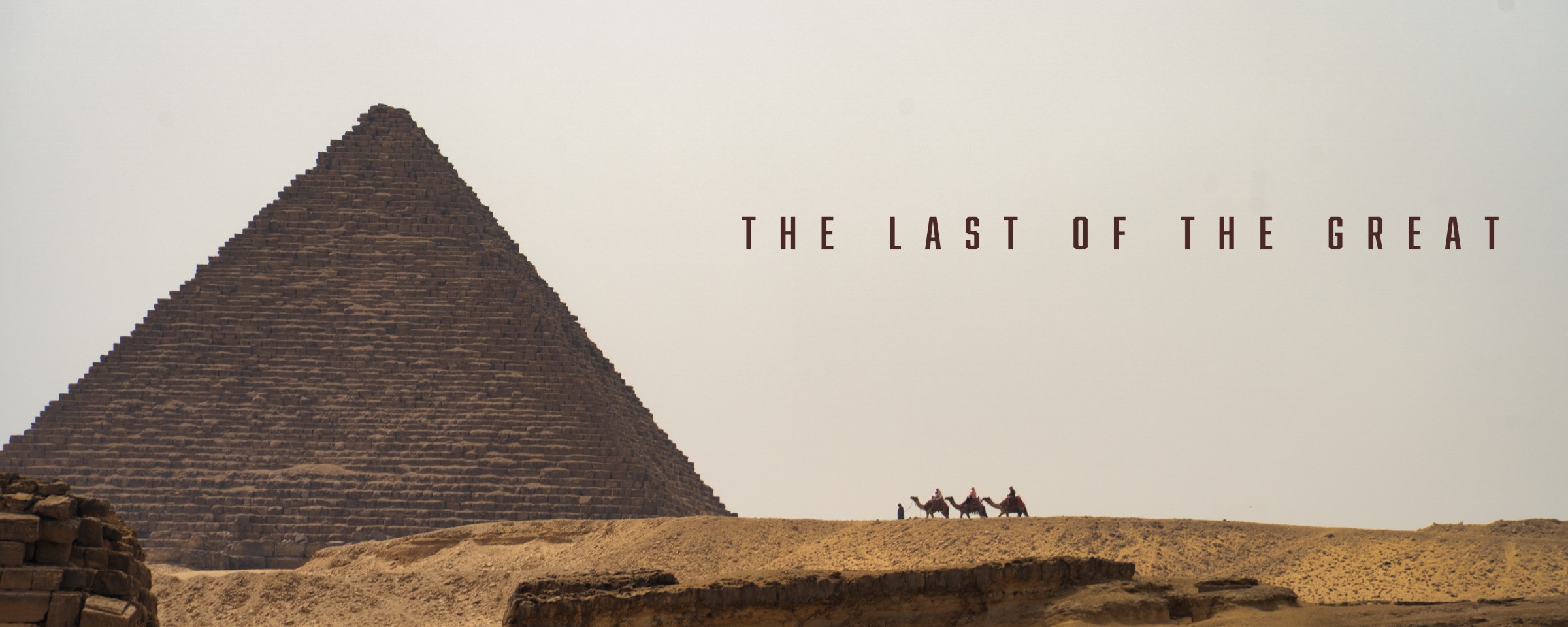 A pyramid and distant camel riders beneath the title The Last of the Great.